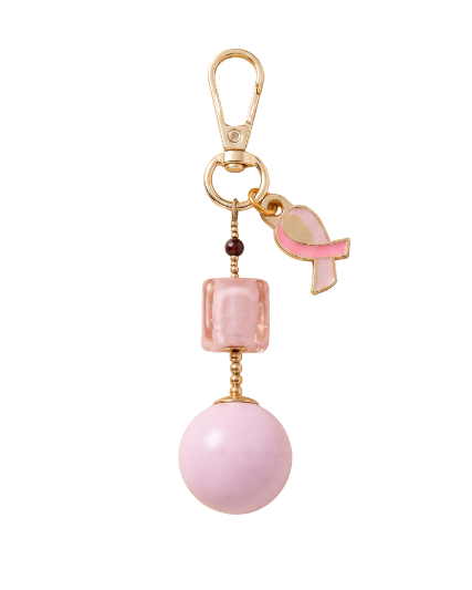 Le porte-clés Mémomamo : une petite bille et une grande bille reliées à un ruban rose.